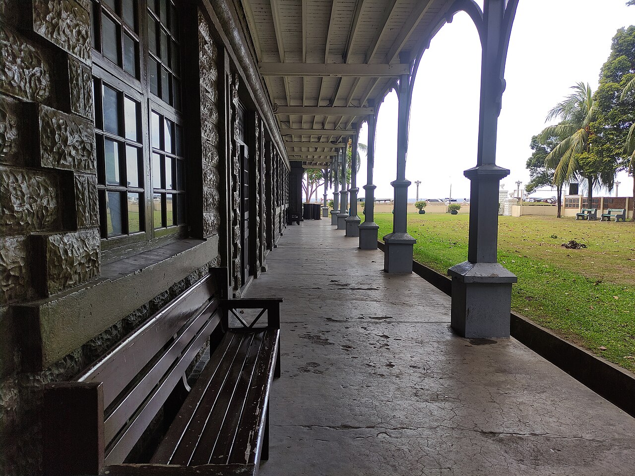 A colonnaded veranda in a historic building.